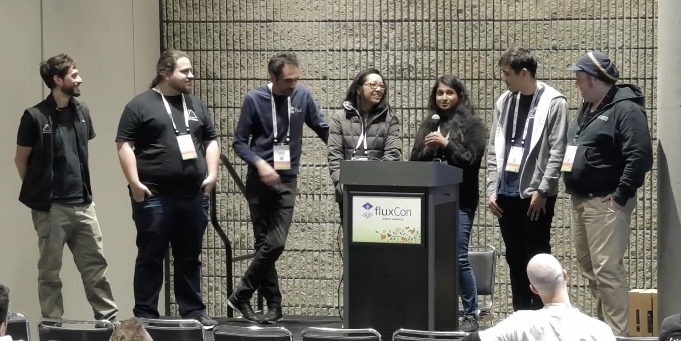 Flux Maintainer, Stefan Prodan, speaking to a crowd at KubeCon